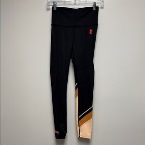 P.E Nation Black Leggings with Orange Logo Patch